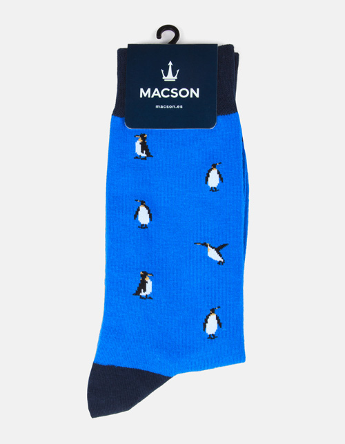Sock with penguin drawings.